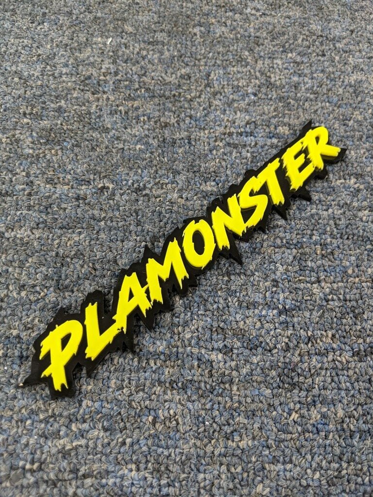 Plamonster Car Badge - Yellow On Gloss Black - Lightning Font - Atomic Car Concepts