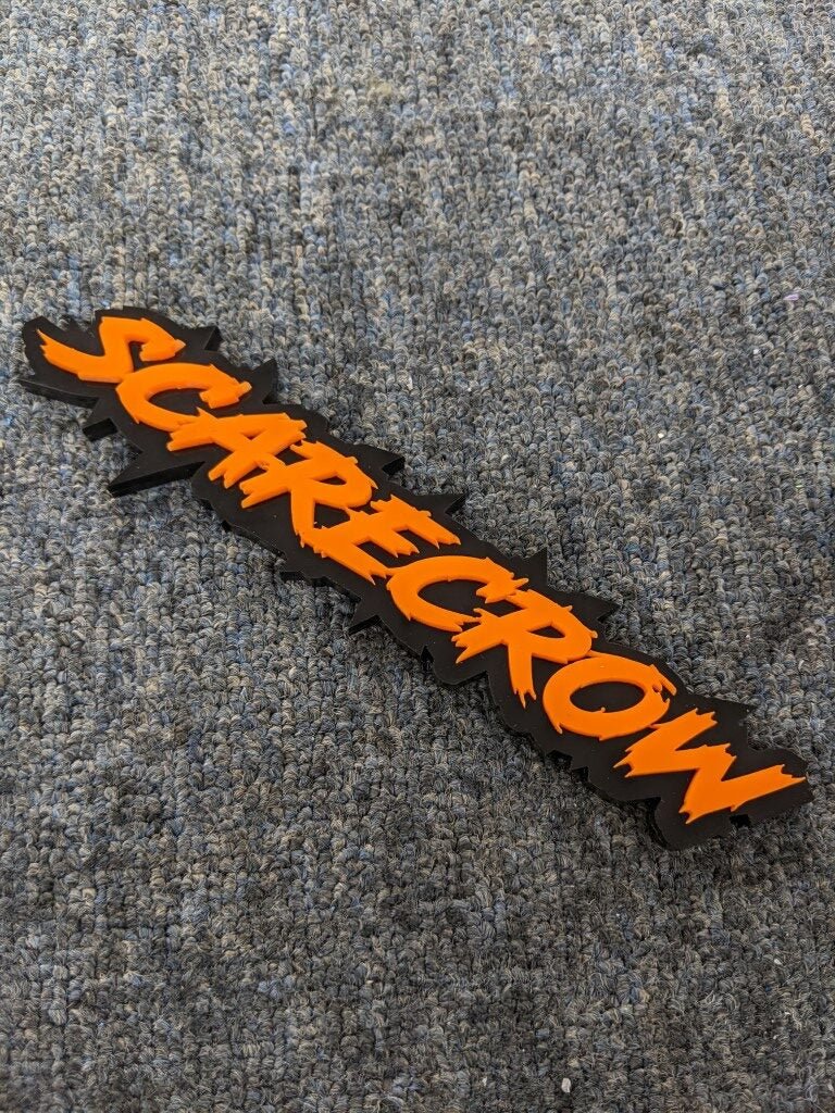 Scarecrow Car Badge - Orange on Matte Black - Lightning Font - Atomic Car Concepts