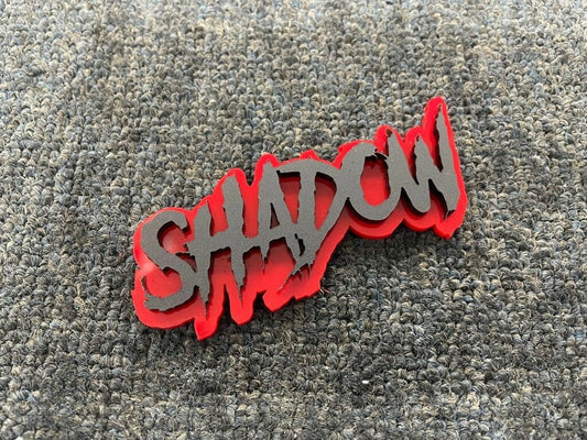 Shadow Car Badge - Matte Black On Red - Aggressive Font - Atomic Car Concepts