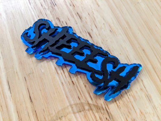 Sheeesh Car Badge - Matte Black On Mirror Blue - Aggressive Font - Atomic Car Concepts