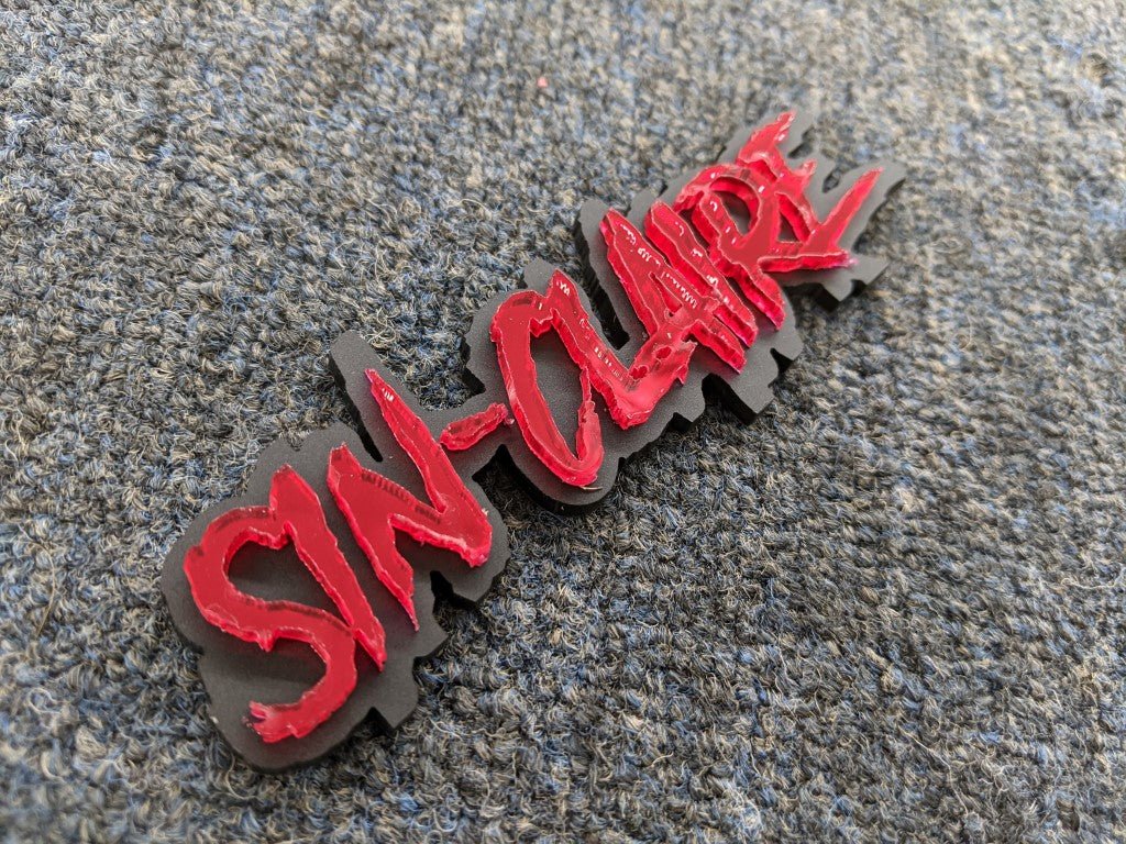 Sin Claire Car Badge - Mirror Red On Matte Black - Aggressive Font - Atomic Car Concepts