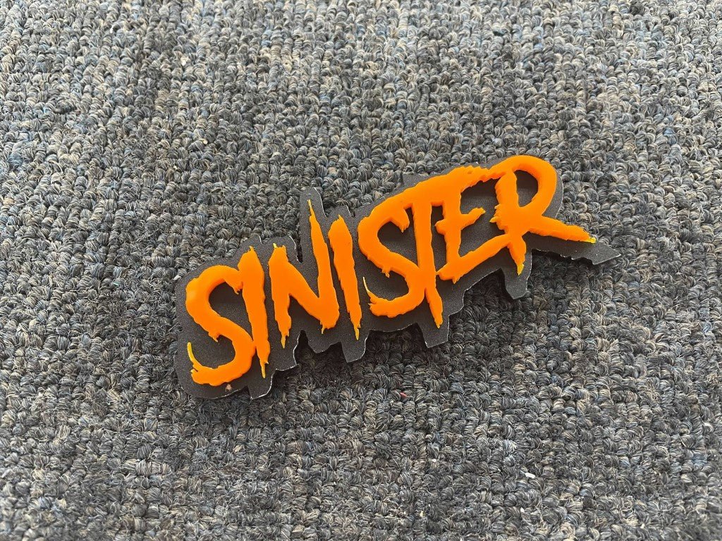 Sinister Car Badge - Orange On Matte Black - Aggressive Font - Atomic Car Concepts