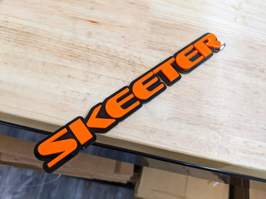 Skeeter Car Badge - Orange on Gloss Black - OEM Font - Tape Mounting - Atomic Car Concepts