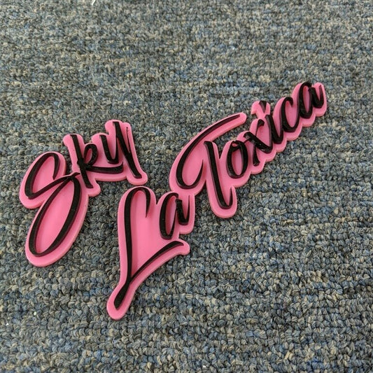 Sky La Toxica Car Badge - Gloss Black On Pink - Script Font - Atomic Car Concepts