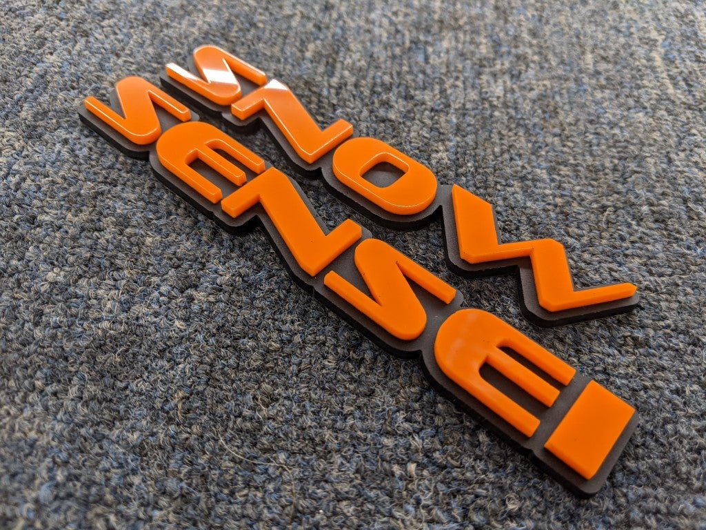 Snow Sensei Car Badge - Mirror Orange On Matte Black - OEM Font - Atomic Car Concepts