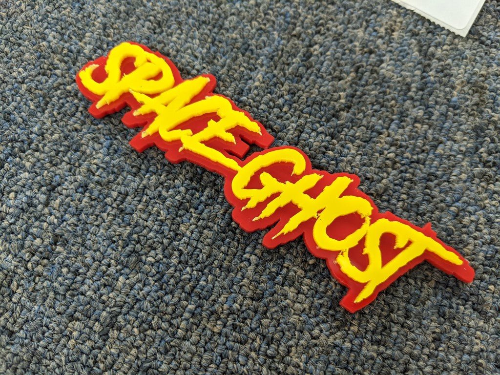 Space Ghost Car Badge - Yellow On Red - Aggressive Font - Atomic Car Concepts