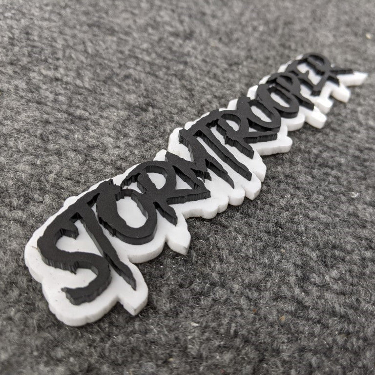 Stormtrooper Car Badge - Matte Black on White - Aggressive Font - Tape Mounting - Atomic Car Concepts