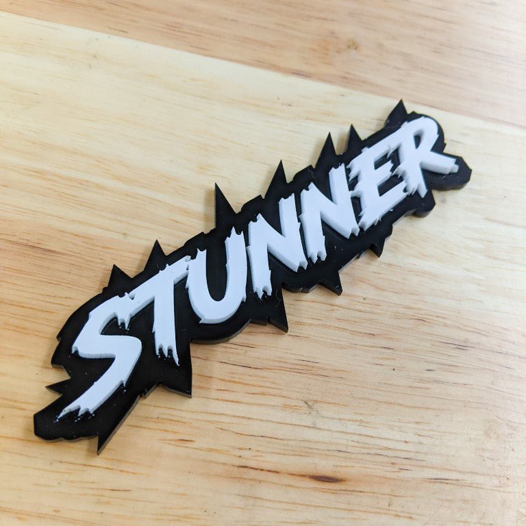 Stunner Car Badge - White on Gloss Black - Lightning Font - Tape Mounting - Atomic Car Concepts