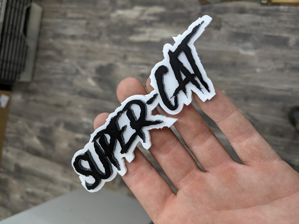 Super Cat Car Badge - Gloss Black On White - Aggressive Font - Atomic Car Concepts