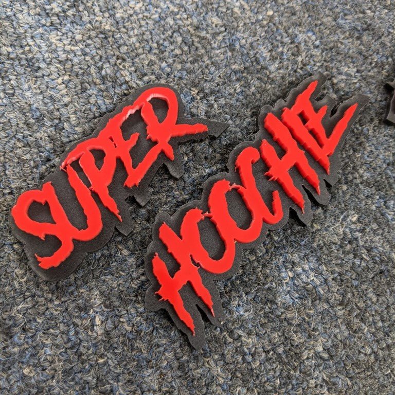 Super Hoochie Car Badge - Red on Matte Black - Aggressive Font - Tape Mounting - Atomic Car Concepts