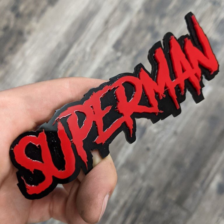 Superman Car Badge - Red On Gloss Black - Aggressive Font - Atomic Car Concepts