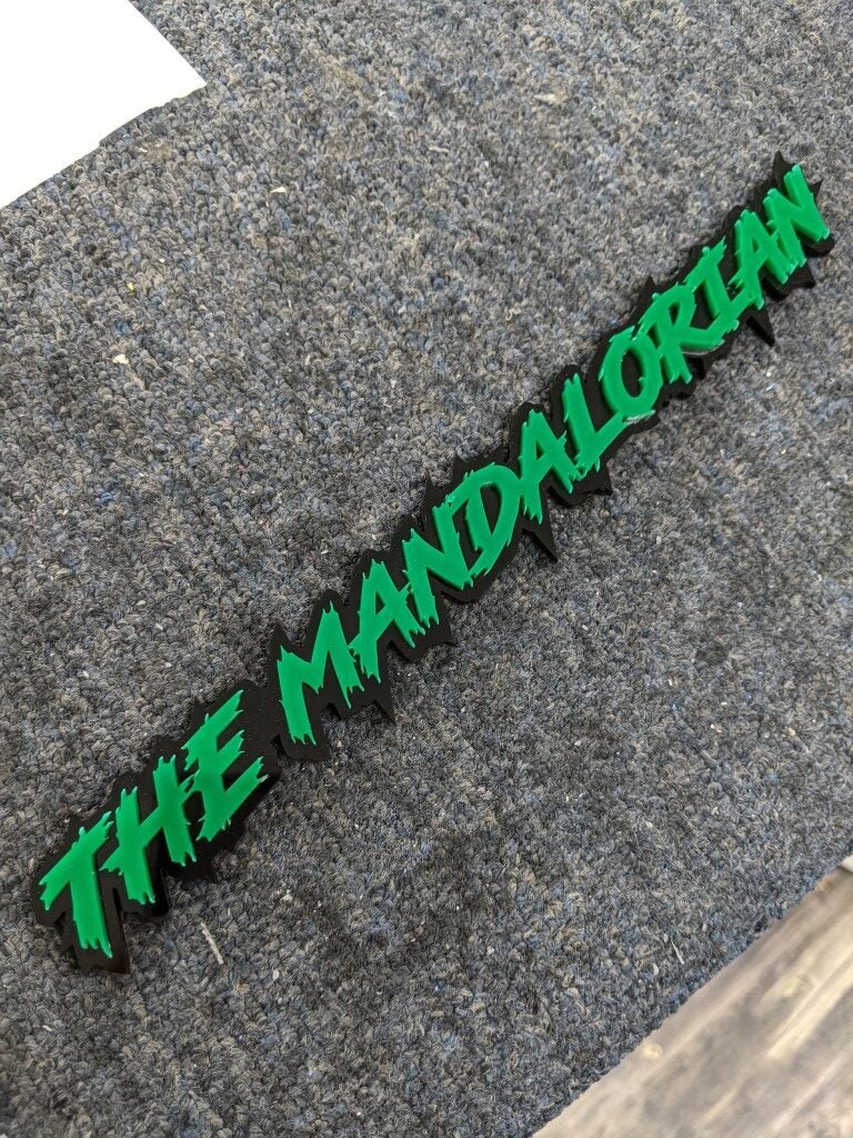 The Mandalorian Car Badge - Green on Gloss Black - Lightning Font - Atomic Car Concepts