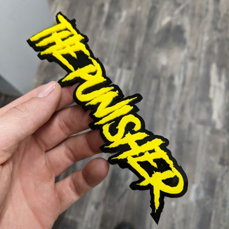 The Punisher Car Badge - Yellow On Gloss Black - Aggressive Font - Atomic Car Concepts