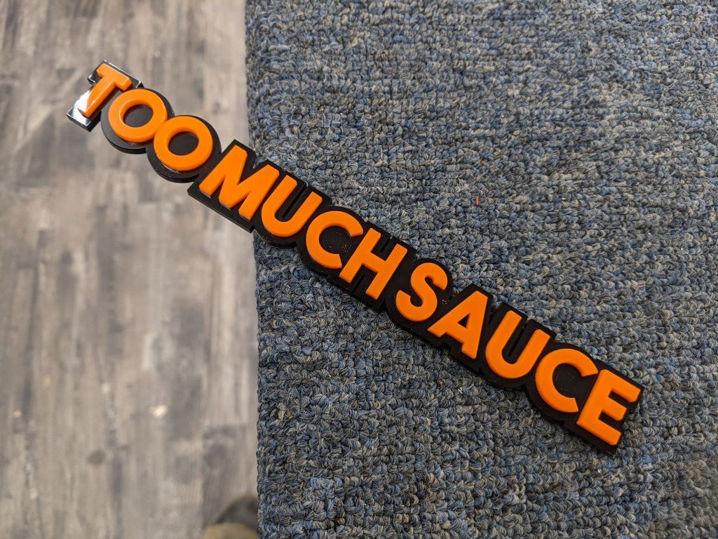 Too Much Sauce Car Badge - Orange On Gloss Black - Block Font - Atomic Car Concepts