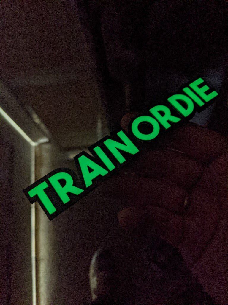 Train Or Die Car Badge - Glow In The Dark - Block Font - Atomic Car Concepts