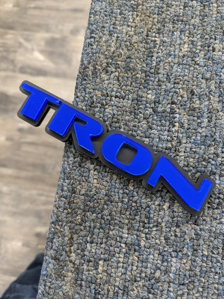 Tron Car Badge - Blue On Matte Black - OEM Font - Atomic Car Concepts