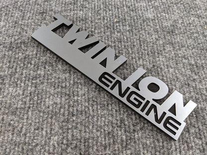 Twin Ion Engine Badge - Black and Brushed - Atomic Car Concepts