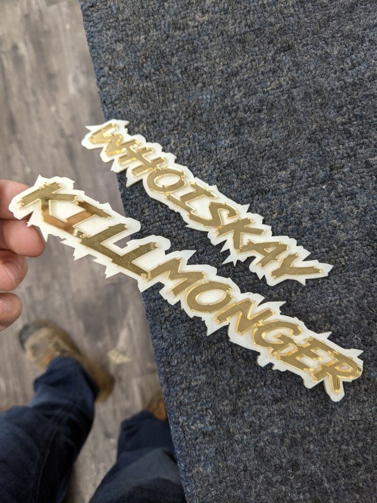 Whoiskay Killmonger Car Badge - Mirror Gold On White - Lightning Font - Atomic Car Concepts